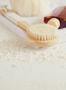 Spa beauty concept. Anti-cellulite massage. Bath Accessories on white stone background, top view, copy space Royalty Free Stock Photo