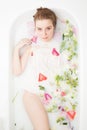 Spa beauty girl bathing in milk bath, spa and skin care concept. Beauty young Woman with perfect slim body and soft skin, in Royalty Free Stock Photo