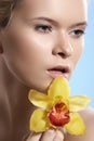 Spa beauty with orchid flower, wellness, skin care, beautiful face Royalty Free Stock Photo