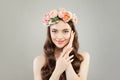 Spa beauty portrait of beautiful woman with clear skin, healthy hair wearing flowers wreath Royalty Free Stock Photo