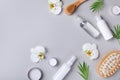 Spa, beauty treatment and wellness background with massage brush, orchid flowers and cosmetic products. Top view and flat lay Royalty Free Stock Photo