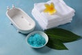 Spa and body care products. Aromatic blue bath Dead Sea Salt on the blue background.