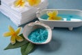 Spa and body care products. Aromatic blue bath Dead Sea Salt on the blue background.