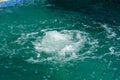 Splash of blue water in swimming pool close up Royalty Free Stock Photo