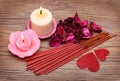 Spa. Burning candles with dried roses leaves, incense sticks Royalty Free Stock Photo