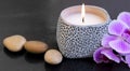 Spa candle setting with massage stones Royalty Free Stock Photo