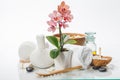 Spa composition with beautiful pink orchid over white Royalty Free Stock Photo