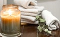 Spa composition with burning candle and bath towels Royalty Free Stock Photo