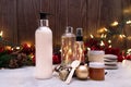 Spa composition with Essentials oils in  bottles and Christmas Holiday decoration. Royalty Free Stock Photo