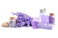 Spa composition with flowers of lavender, cream, salt and soap on white background