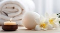 Spa composition massage herbal ball, plumeria flower in vase,coconut coffee soap, white towels and candle. AI Generative Royalty Free Stock Photo