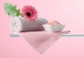 Spa composition with pink salt, Gerber, and towels Royalty Free Stock Photo