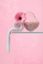 Spa composition with pink salt, Gerber, and towels Royalty Free Stock Photo