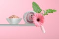 Spa composition with pink salt, Gerber, and towels Royalty Free Stock Photo