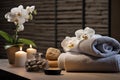 Spa composition with towels, candles and orchids on wooden table. Relaxation therapy. Close-up photography. Generative AI Royalty Free Stock Photo