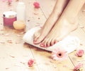 Spa compositions of female feet and rose petals Royalty Free Stock Photo