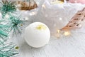 Spa concept with bath bomb, fir tree branch over ligths Royalty Free Stock Photo