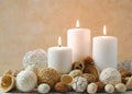 Spa concept of burning white candles decorated with natural dried potpourri Royalty Free Stock Photo