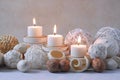 Spa concept of burning white candles decorated with natural dried potpourri Royalty Free Stock Photo