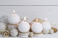Spa concept of burning white candles decorated with natural dried potpourri Royalty Free Stock Photo