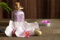 Spa concept with candle and orchid abstract still life Royalty Free Stock Photo