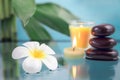 Spa concept with candle, stone, flower and bamboo