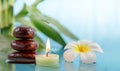 Spa concept with candle, stone, flower and bamboo