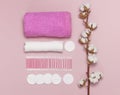 Spa concept. Flat lay background with cotton branch, cotton pads, eared sticks, pink towel. Cotton Cosmetic Makeup Removers Royalty Free Stock Photo