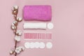 Spa concept. Flat lay background with cotton branch, cotton pads, eared sticks, pink towel. Cotton Cosmetic Makeup Removers Royalty Free Stock Photo