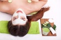 Spa concept. Hand applying nourishing mask on female face in spa Royalty Free Stock Photo