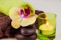 Spa concept with lava stones, orchid and candle Royalty Free Stock Photo