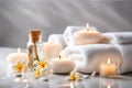 Spa concept, massage stones with towels, candles and frangipani flowers. Royalty Free Stock Photo