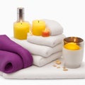 Spa Concept - Massage Stones With Towels And Candles isolated on white background