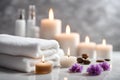 Spa concept, massage stones with towels, candles and lavender flowers. Royalty Free Stock Photo