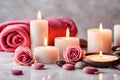 Spa concept, massage stones with towels, candles and pink roses. Royalty Free Stock Photo