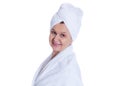 Spa concept portrait. Aged good looking woman with white towel on her headCity background made of many building silhouettes