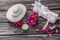 Spa concept. Rocks,candle and bath white towels on wooden background. Royalty Free Stock Photo