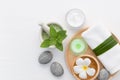 Spa concept with salt, mint, lotion, towel, candle, stone and fl Royalty Free Stock Photo