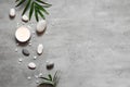 Spa concept on stone background, palm leaves, candle and zen, grey stones, top view Royalty Free Stock Photo