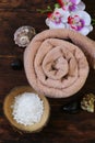 Spa concept - towel, salt and orchid Royalty Free Stock Photo