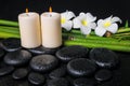 Spa concept of zen basalt stones, three white flower frangipani Royalty Free Stock Photo