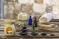 Spa concept: zen stones, candles and flowers against old stone wall on the background Royalty Free Stock Photo