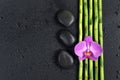 Spa concept with zen stones, orchid flower and bamboo Royalty Free Stock Photo