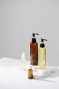 Spa cosmetics in brown glass bottles on gray concrete table. Copy space for text. Royalty Free Stock Photo