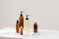 Spa cosmetics in brown glass bottles on gray concrete table Royalty Free Stock Photo