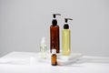 Spa cosmetics in brown glass bottles on gray concrete table. Copy space for text. Beauty blogger, salon therapy, branding mockup, Royalty Free Stock Photo