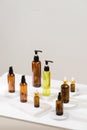 Spa cosmetics in brown glass bottles on gray concrete table Royalty Free Stock Photo