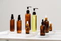 Spa cosmetics in brown glass bottles on gray concrete table Royalty Free Stock Photo