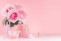 Spa cosmetics products, roses in pastel pink and silver color - cream, bath salt, essential oil, soap, bottle, bowl, towel. Royalty Free Stock Photo