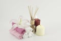 Spa decoration with candles, towels and aromatherapy oil bottle Royalty Free Stock Photo
